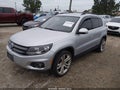2013 Volkswagen Tiguan — photo 2 of 13 | VIN WVGBV7AX2DW551320