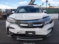 2020 Honda Pilot — photo 12 of 16 | VIN 5FNYF6H00LB016021