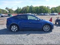 2023 Tesla Model Y — photo 13 of 19 | VIN 7SAYGAEE6PF829842
