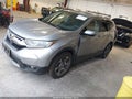 2018 Honda CR-V — photo 2 of 17 | VIN 7FARW1H5XJE031310