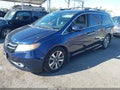 2014 Honda Odyssey — photo 2 of 17 | VIN 5FNRL5H99EB001008