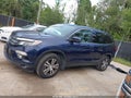 2018 Honda Pilot — photo 14 of 16 | VIN 5FNYF5H51JB019769