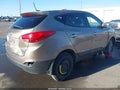 2012 Hyundai Tucson — photo 4 of 19 | VIN KM8JUCAC1CU355335