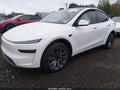 2026 Tesla Model Y — photo 2 of 14 | VIN 7SAYGDEE7TA634342