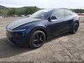 2026 Tesla Model Y — photo 2 of 10 | VIN 7SAYGDEE7TA767702