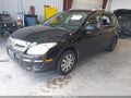 2011 Hyundai Elantra — photo 2 of 17 | VIN KMHDC8AE5BU090657