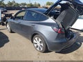 2023 Tesla Model Y — photo 3 of 14 | VIN 7SAYGAEE4PF911391