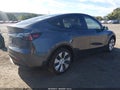2023 Tesla Model Y — photo 4 of 15 | VIN 7SAYGDEE1PA123098