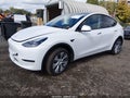 2023 Tesla Model Y — photo 2 of 11 | VIN 7SAYGDEE8PA163842