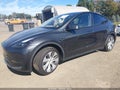 2024 Tesla Model Y — photo 2 of 10 | VIN 7SAYGDED0RF091709
