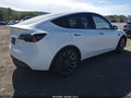 2023 Tesla Model Y — photo 4 of 10 | VIN 7SAYGDEF8PF841100