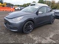 2023 Tesla Model Y — photo 2 of 11 | VIN 7SAYGDEF7PF824885