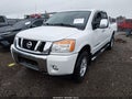 2015 Nissan Titan — photo 2 of 16 | VIN 1N6AA0ECXFN507808