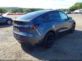 2023 Tesla Model Y — photo 4 of 10 | VIN 7SAYGDEE9PF889969