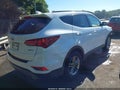 2017 Hyundai Santa Fe — photo 4 of 17 | VIN 5NMZU3LB2HH017078