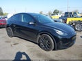 2022 Tesla Model Y — photo 1 of 15 | VIN 7SAYGDEE0NF307741