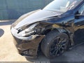 2022 Tesla Model Y — photo 6 of 15 | VIN 7SAYGDEE0NF307741