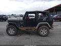 1999 Jeep Wrangler — photo 13 of 15 | VIN 1J4FY19S8XP402289