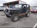 1999 Jeep Wrangler — photo 2 of 15 | VIN 1J4FY19S8XP402289