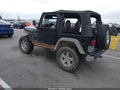 1999 Jeep Wrangler — photo 3 of 15 | VIN 1J4FY19S8XP402289