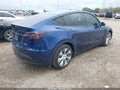 2023 Tesla Model Y — photo 4 of 18 | VIN 7SAYGDEE7PA155697