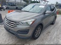 2015 Hyundai Santa Fe — photo 2 of 11 | VIN 5XYZT3LB4FG274835