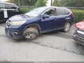2015 Honda CR-V — photo 2 of 16 | VIN 5J6RM3H51FL012933