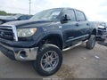 2013 Toyota Tundra — photo 2 of 15 | VIN 5TFDW5F1XDX317987