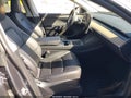 2023 Tesla Model Y — photo 5 of 16 | VIN 7SAYGDED7PF977409