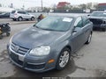 2009 Volkswagen Jetta — photo 2 of 11 | VIN 3VWRL71K59M065862