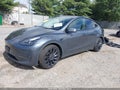 2022 Tesla Model Y — photo 2 of 18 | VIN 7SAYGDEF2NF465832