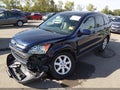 2009 Honda CR-V — photo 2 of 17 | VIN 5J6RE48769L065653