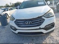 2017 Hyundai Santa Fe — photo 6 of 16 | VIN 5XYZU3LB0HG435701