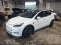 2022 Tesla Model Y — photo 2 of 18 | VIN 7SAYGDEFXNF535660