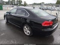 2014 Volkswagen Passat — photo 3 of 11 | VIN 1VWBT7A37EC034389