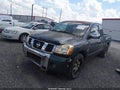 2004 Nissan Titan — photo 2 of 11 | VIN 1N6AA06A14N547804