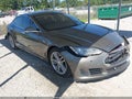 2015 Tesla Model S — photo 1 of 15 | VIN 5YJSA1S25FF095885