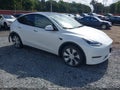 2023 Tesla Model Y — photo 1 of 19 | VIN 7SAYGDEE7PF696350