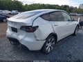 2023 Tesla Model Y — photo 6 of 19 | VIN 7SAYGDEE7PF696350