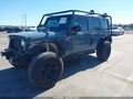 2015 Jeep Wrangler Unlimited — photo 2 of 17 | VIN 1C4BJWDG2FL598180