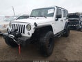 2016 Jeep Wrangler Unlimited — photo 2 of 11 | VIN 1C4BJWEG9GL201404