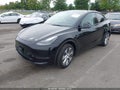 2023 Tesla Model Y — photo 2 of 15 | VIN 7SAYGDEE2PA185965