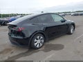 2023 Tesla Model Y — photo 4 of 15 | VIN 7SAYGDEE2PA185965