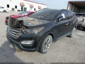 2016 Hyundai Santa Fe — photo 2 of 10 | VIN 5XYZUDLA1GG361183