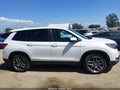 2022 Honda Passport — photo 13 of 16 | VIN 5FNYF7H58NB001710
