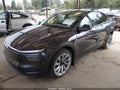 2026 Tesla Model Y — photo 2 of 16 | VIN 7SAYGDEE3TF561862