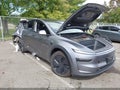 2026 Tesla Model Y — photo 1 of 15 | VIN 7SAYGDEEXTF340193