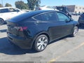 2023 Tesla Model Y — photo 4 of 18 | VIN 7SAYGDEE5PF639516