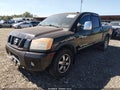 2011 Nissan Titan — photo 2 of 16 | VIN 1N6AA0ECXBN313581