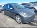 2023 Tesla Model Y — photo 1 of 18 | VIN 7SAYGAEEXPF913727